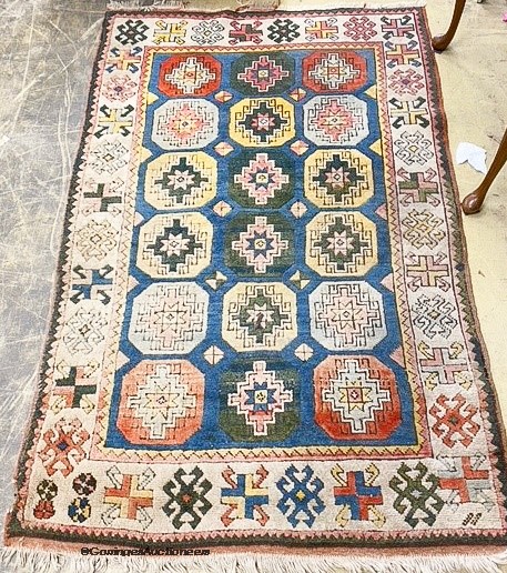 A Caucasian design rug, 204x134cm.